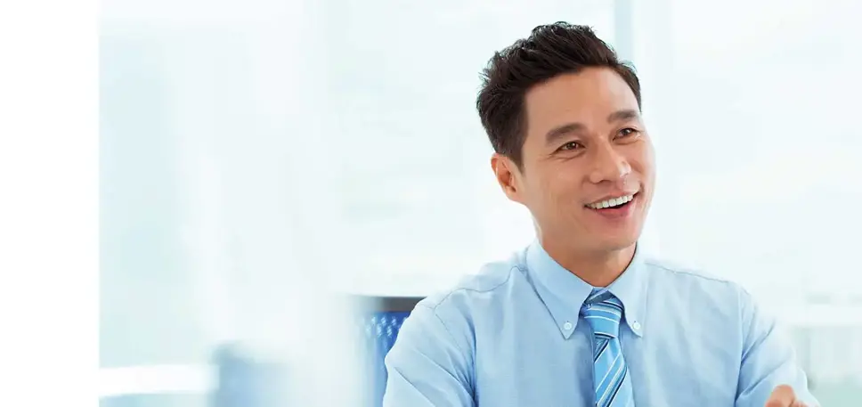 Two men in an office setting are in conversation