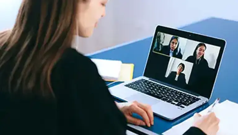 Office worker engaging in a video call on their laptop 